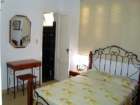 'Bedroom in the house of the owners (below the independent apartment)' Casas particulares are an alternative to hotels in Cuba. Check our website cubaparticular.com often for new casas.